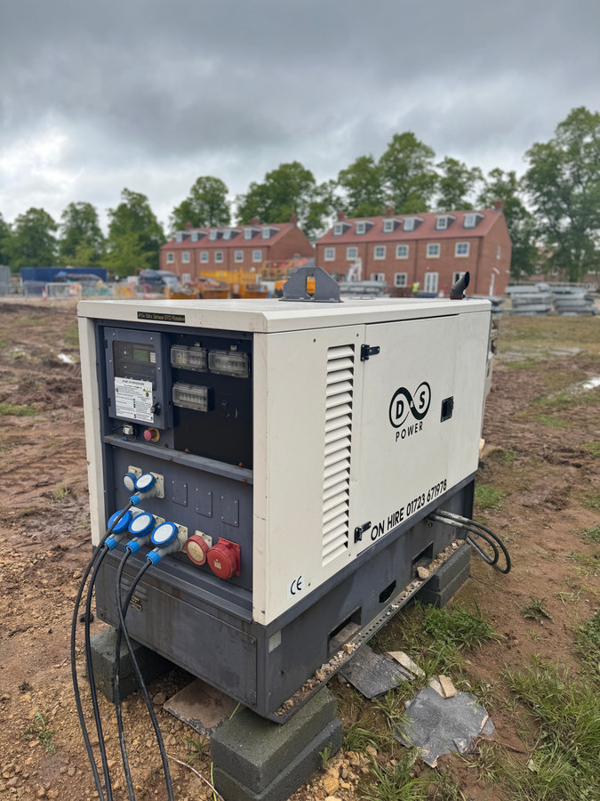 D&S Power generator with electrical cables supplying a construction site
