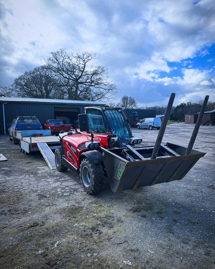 Red telehandler in the yard